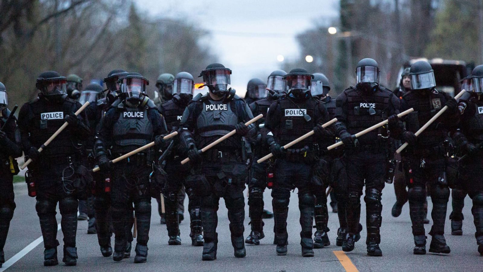 Picture of Police forming A line with riot gear on